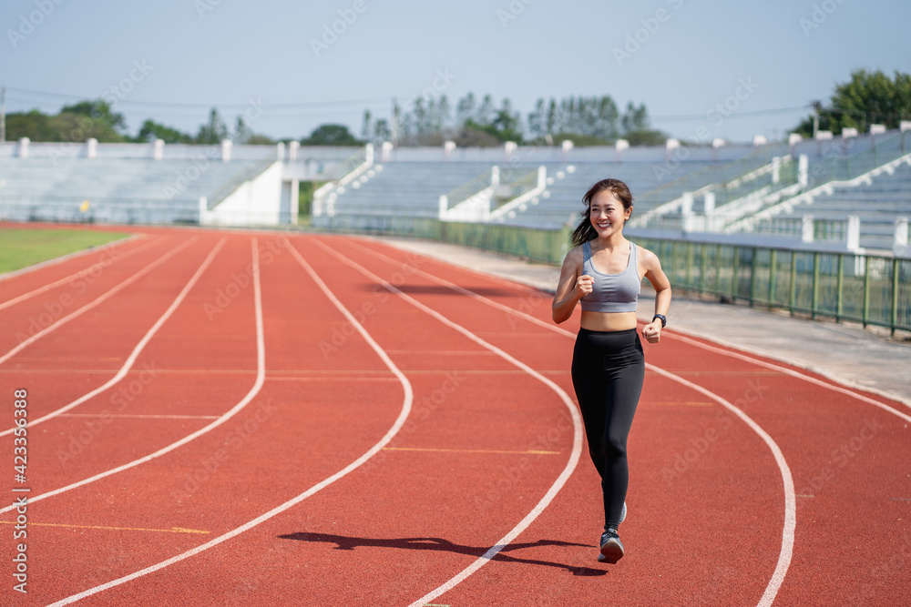 Asian woman runners she exercises in the morning. She is training for running. Sports and health concept.