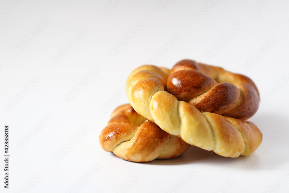 Traditional wicker round bread in the form of a circle. Round bread is braided like a pigtail Traditional wicker round bread in the form of a circle. Round bread is braided like a pigtail