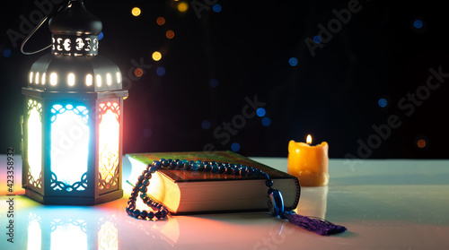 Photography Candle light lids on muslim style's lantern shining on quran