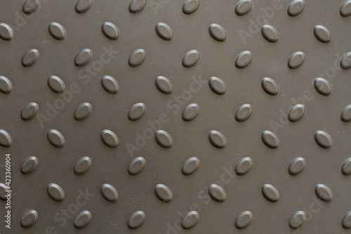 A background of bulging pimples. Plastic shoe tray. Background with gray raised details. Bulging oval elements