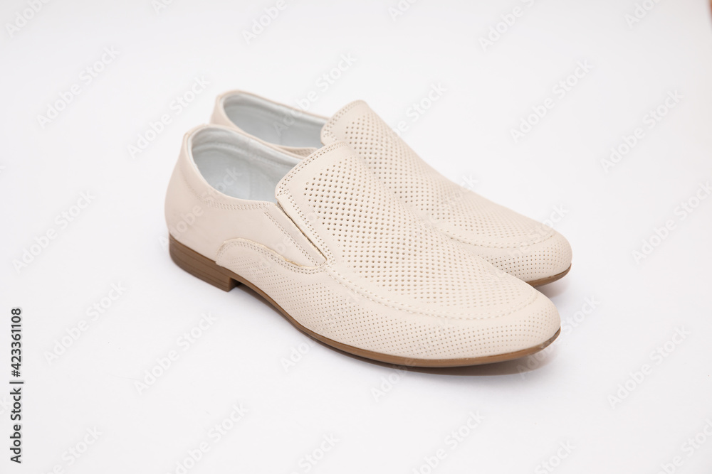 Mens white shoes on a white background Mens white shoes on a white background