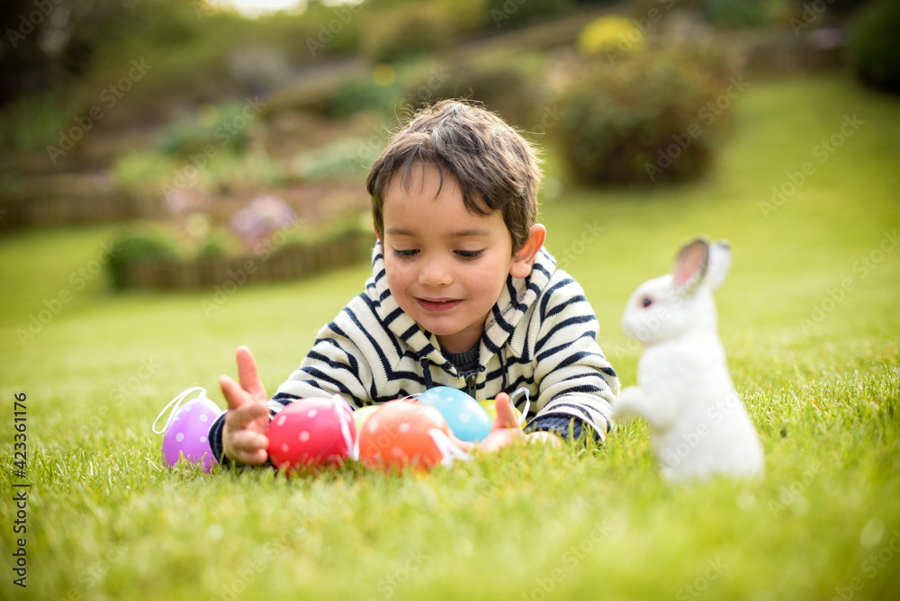 young child during the easter egg hunt young child during the easter egg hunt