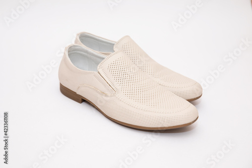 Mens white shoes on a white background