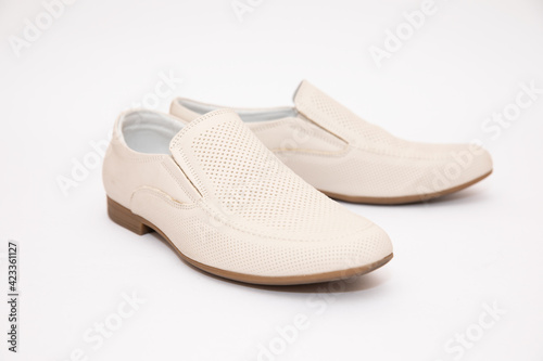 Mens white shoes on a white background
