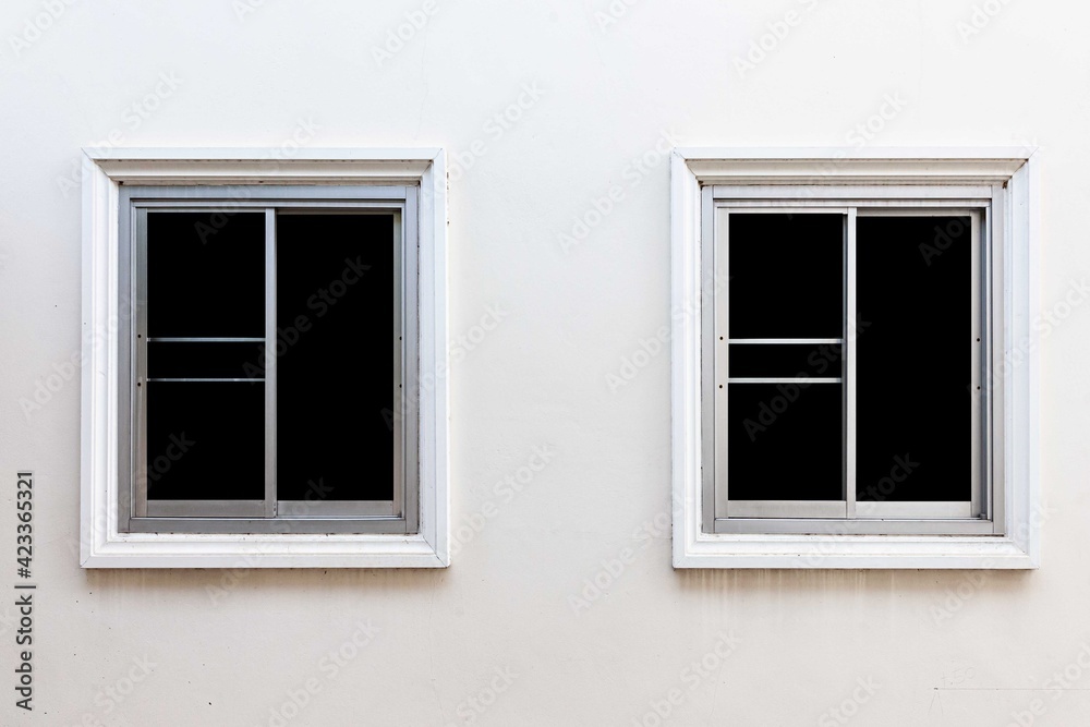 White sliding aluminum window frame and white cement wall