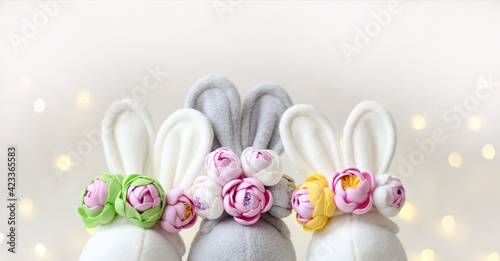 Fototapeta Naklejka Na Ścianę i Meble -  The ears of rabbits and spring flowers.Creative Easter greeting card.