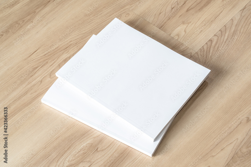Book cover mockup with blank white front paper page a4 paperback mock up for catalog, magazine, menu, booklet, notebook, portfolio design template on wood table background Book cover mockup with blank white front paper page a4 paperback mock up for catalog, magazine, menu, booklet, notebook, portfolio design template on wood table background