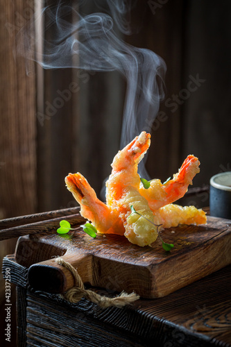 Shrimp in tempura with sweet sauce. Old Chinese cuisine.