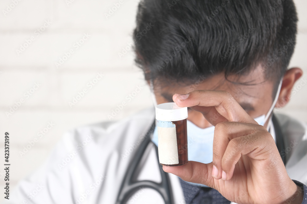 doctor hand holding pill container with copy space doctor hand holding pill container with copy space