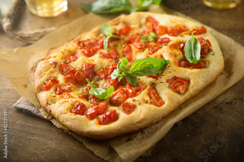 Delicious homemade focaccia with tomatoes and garlic