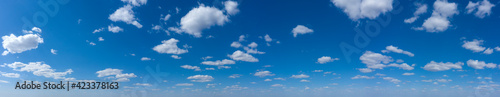 Panoramic fluffy cloud in the blue sky. Sky with cloud on a sunny day.