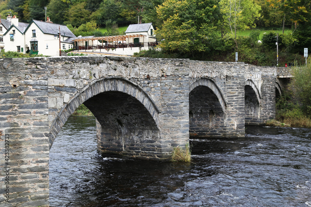 An ancient bridge across the River Dee at Carrog, Wales, UK.