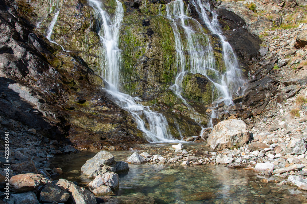 View of waterfall near by Sophia lakes on sunny summer day. Arkhyz, Caucasus, Russia. View of waterfall near by Sophia lakes on sunny summer day. Arkhyz, Caucasus, Russia.