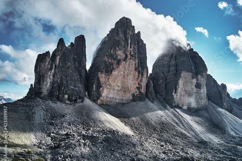 Mountainous landscape with clouds in Three Peaks Nature Park in Italian dolomite Alps, Sesto Dolomites in South Tyrol
