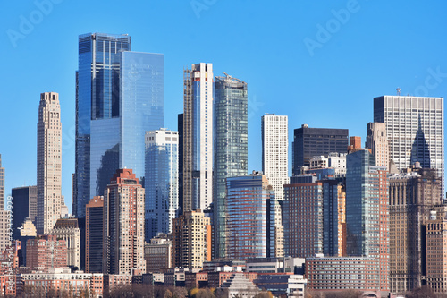 Buildings architecture of Manhattan, New York City seen from Ellis Island, New Jersey, USA. © elephotos