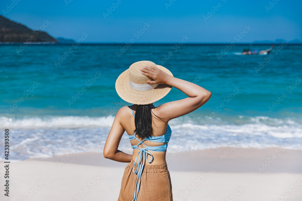 Travel asian woman summertime relax on beach at day in Thailand summer season