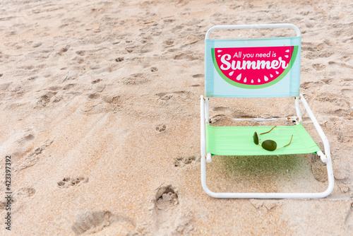 Beach chair in sand during summer holiday