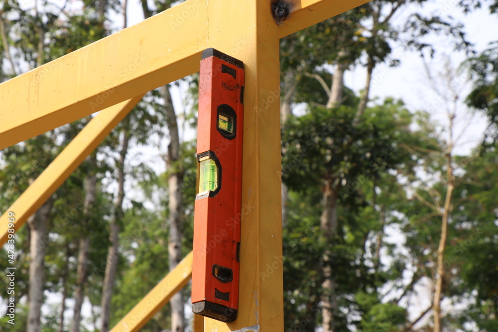 Building steel structures with spirit level attached to square steel tube Building steel structures with spirit level attached to square steel tube