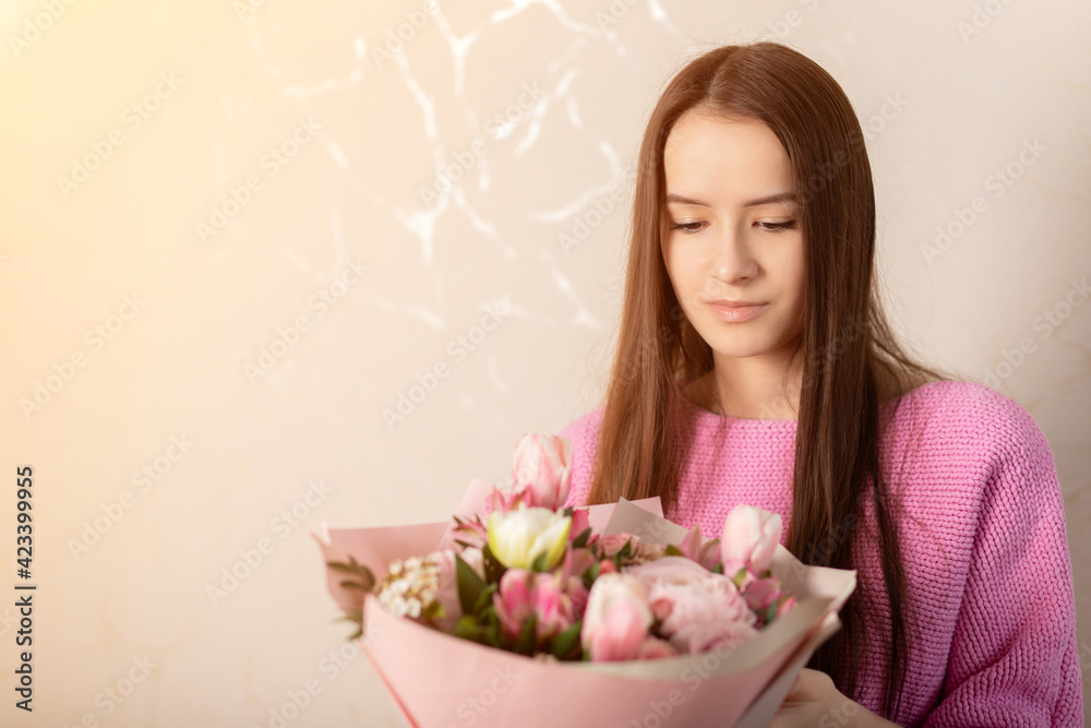 Congratulation happy birthday, anniversary, easter, bouquet of flowers in the hands of a girl Congratulation happy birthday, anniversary, easter, bouquet of flowers in the hands of a girl