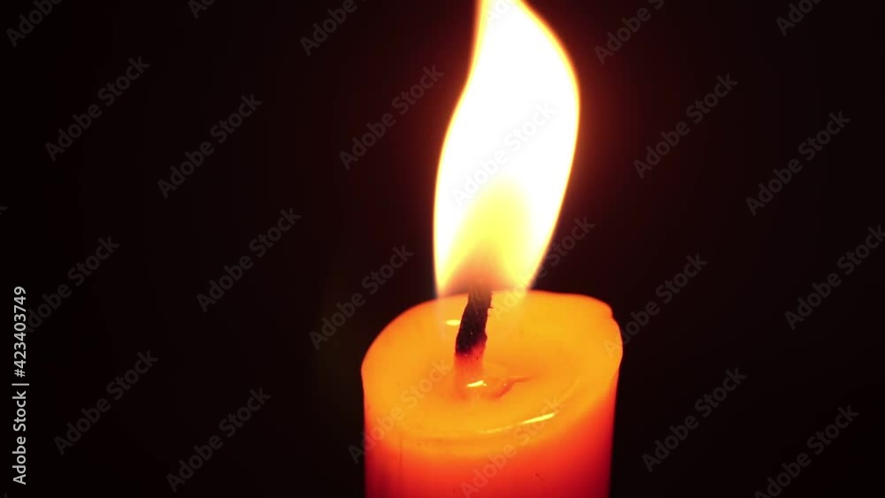 light candle burning brightly,Candle light close up on black background. Burning candle. Candle Flame. light candle burning brightly,Candle light close up on black background. Burning candle. Candle Flame.