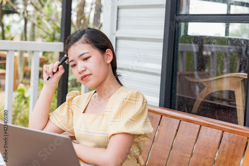 Free Download Beautiful Asian business women contemplate ideas for new business projects. - GFXLoad