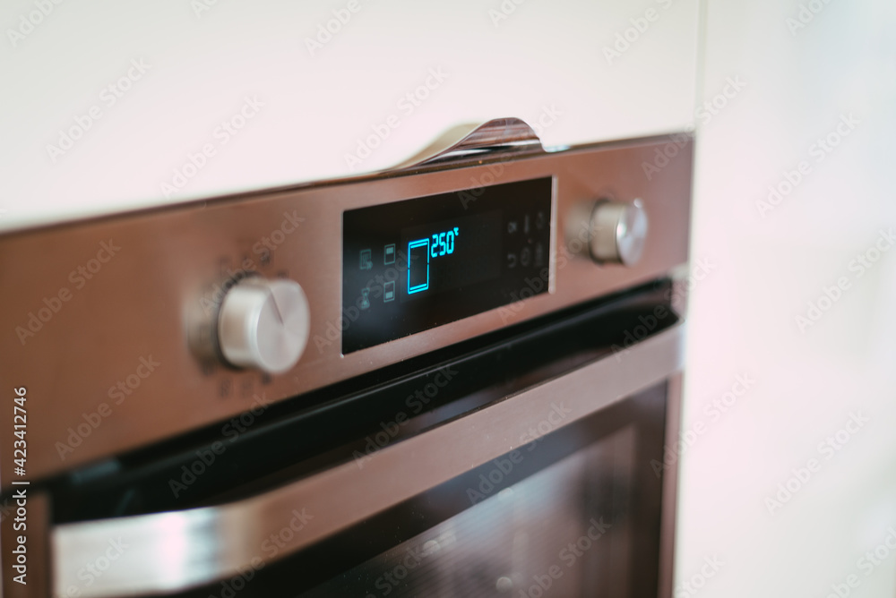 Fototapeta premium oven in the kitchen heated to a high temperature of 250 degrees Celsius - kitchen equipment
