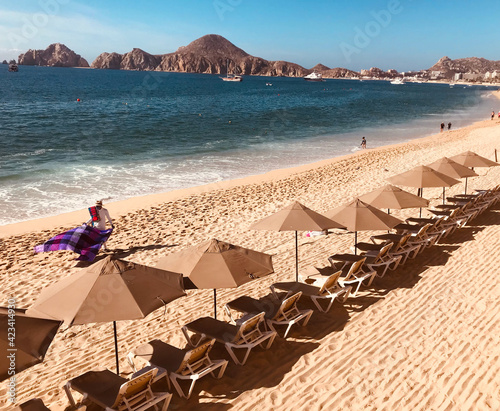 Vendor selling blankets on beach in Cabo San Lucas, Mexico