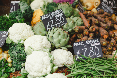 Artichokes and cauliflowers at a market stall in Borough Market, London