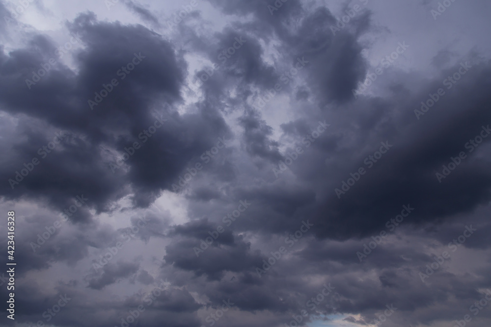 Storm sky with dark cumulus clouds abstract background texture, thunderstorm