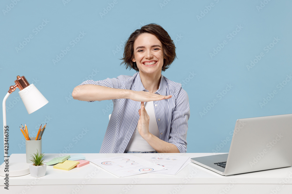 Young happy successful employee business woman in casual shirt sit work ...