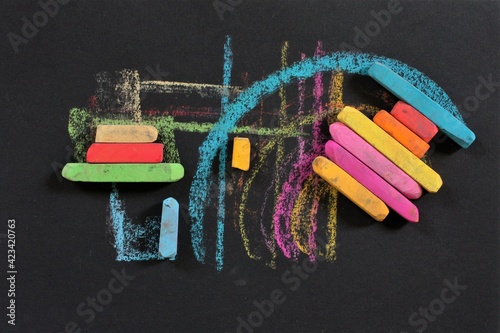 chalk drawing on a black paper