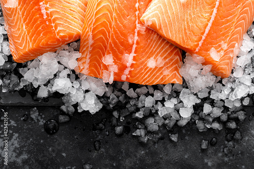 Salmon fillet. Slices of fresh raw salmon fish on ice