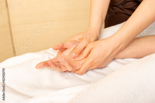 Closeup massage of female hands by physiotherapist. Carpal tunnel syndrome  arthritis  neurological disease concept. Numbness of the hand. Hand massage.