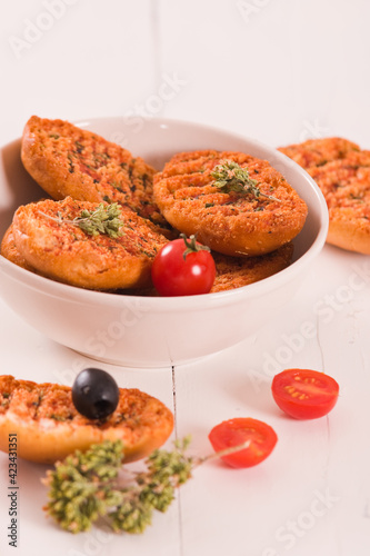 Toasted bread with tomato and oregano. 