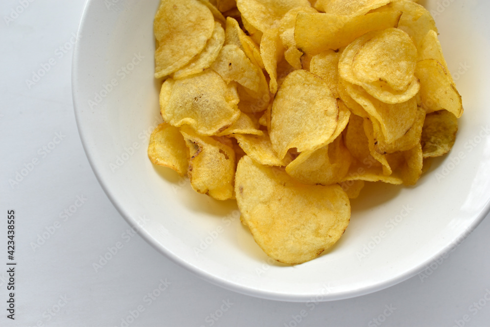 Yellow beautiful delicious chips in a plate Yellow beautiful delicious chips in a plate