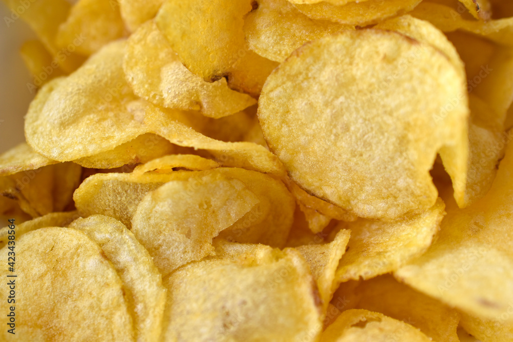 Yellow beautiful delicious chips close up in a restaurant