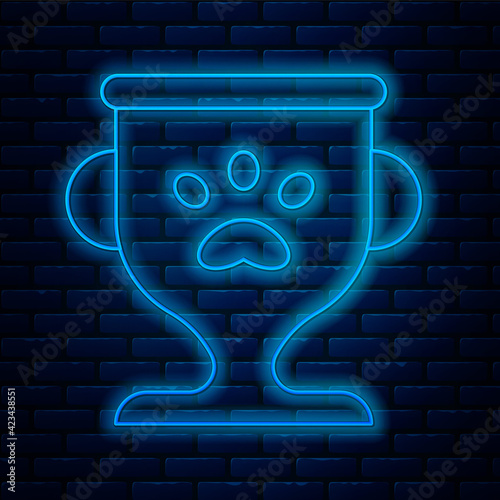 Glowing neon line Pet award symbol icon isolated on brick wall background. Medal with dog footprint as pets exhibition winner concept. Vector
