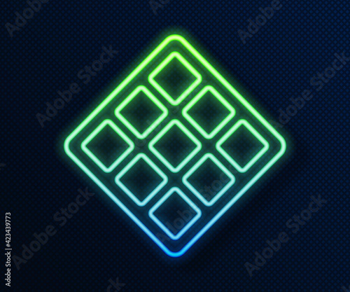 Glowing neon line Waffle icon isolated on blue background. Vector