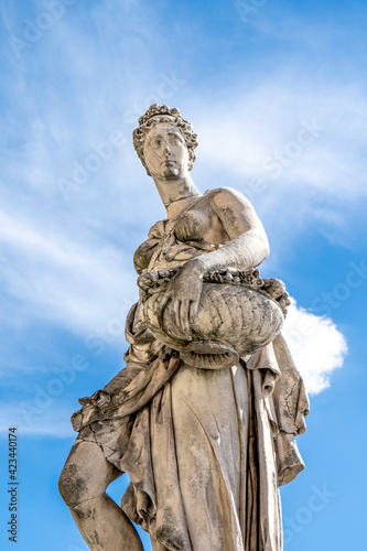 Statue of Spring  sculpted by Italian artist Pietro Francavilla in early 17th century on the Santa Trinita Bridge in Florence city center  Tuscany  Italy