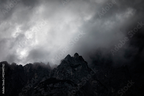 dark couds around mountain peak