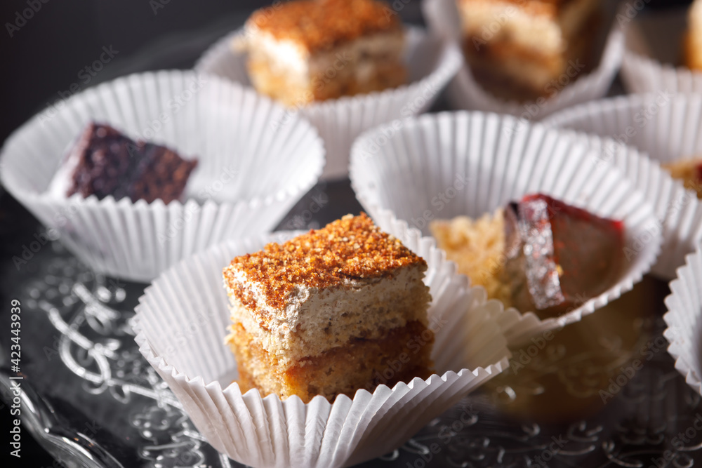 Sponge cake in paper cups on a tray. Sponge cake in paper cups on a tray.