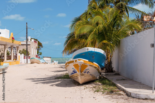 Boats on a sandy road beside the sea. This is a common scene when the fishermen are not able to go out in the coastal fishing town of Chicxulub in the Yucatan state of Mexico. February 28, 2020.