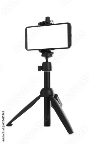Foto Smartphone with blank screen fixed to tripod on white background, mockup for des