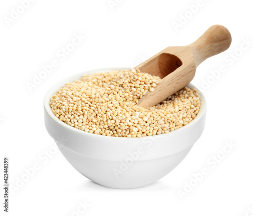 Bowl with quinoa and wooden scoop on white background