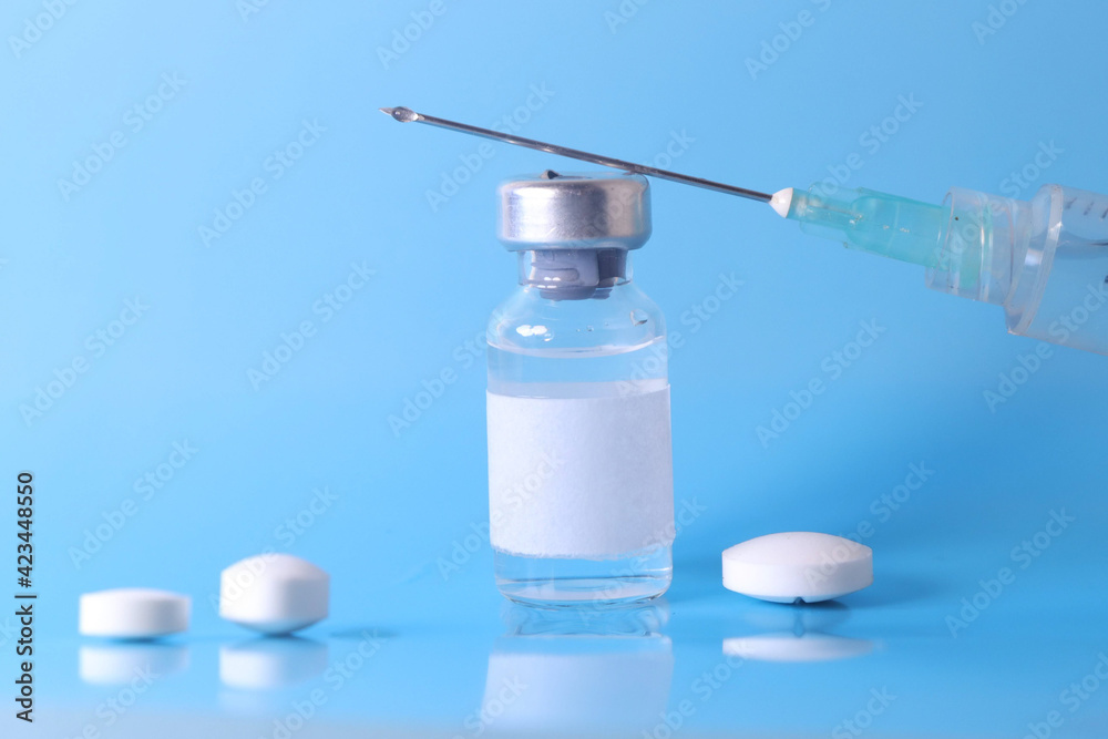 Doctor holding vial with vaccine against Covid-19 on light background, closeup. Coronavirus Vaccine / Corona virus Vaccine concept with syringe. Vaccine Concept of fight against coronavirus.
Doctor holding vial with vaccine against Covid-19 on light background, closeup. Coronavirus Vaccine / Corona virus Vaccine concept with syringe. Vaccine Concept of fight against coronavirus.