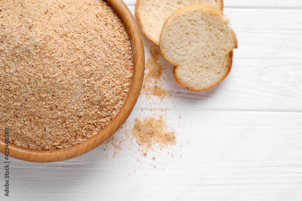 Fresh breadcrumbs on white wooden table, flat lay Fresh breadcrumbs on white wooden table, flat lay