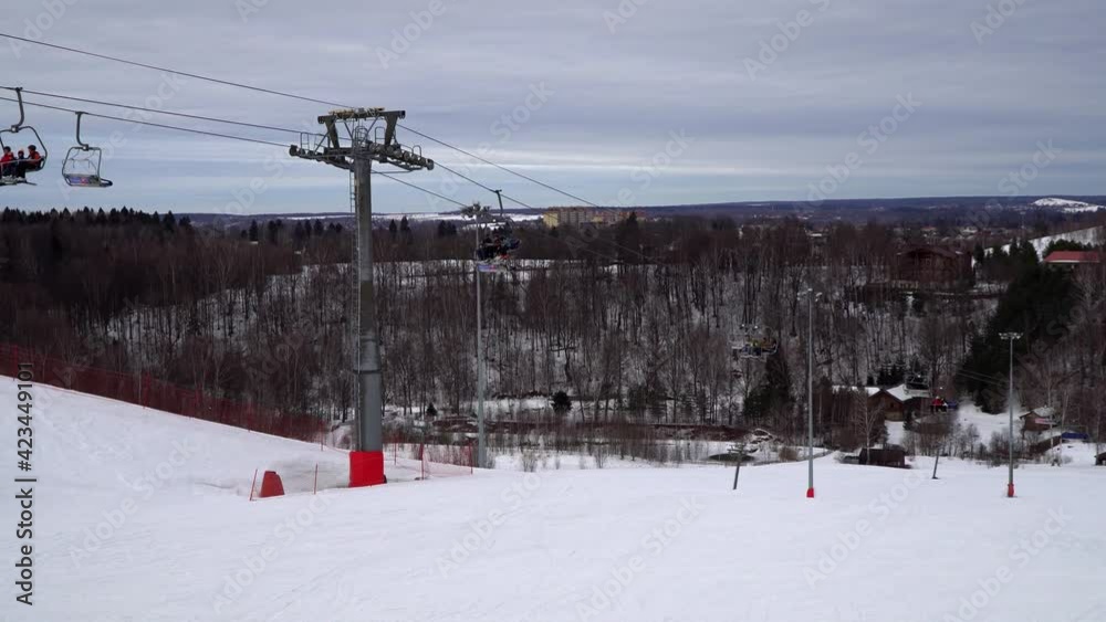 Chairlift and mountain slopes in a ski resort Chairlift and mountain slopes in a ski resort