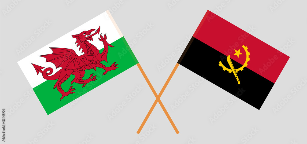 Crossed flags of Wales and Angola. Official colors. Correct proportion Crossed flags of Wales and Angola. Official colors. Correct proportion