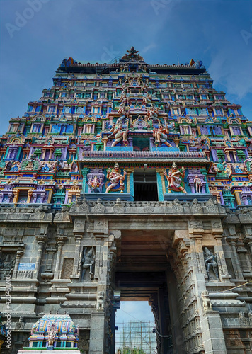 Highly decorated gopuram entrance to Shiva Nataraja temple photo