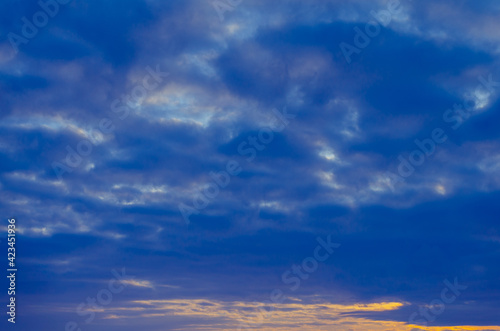 Blue sunset with dark clouds.